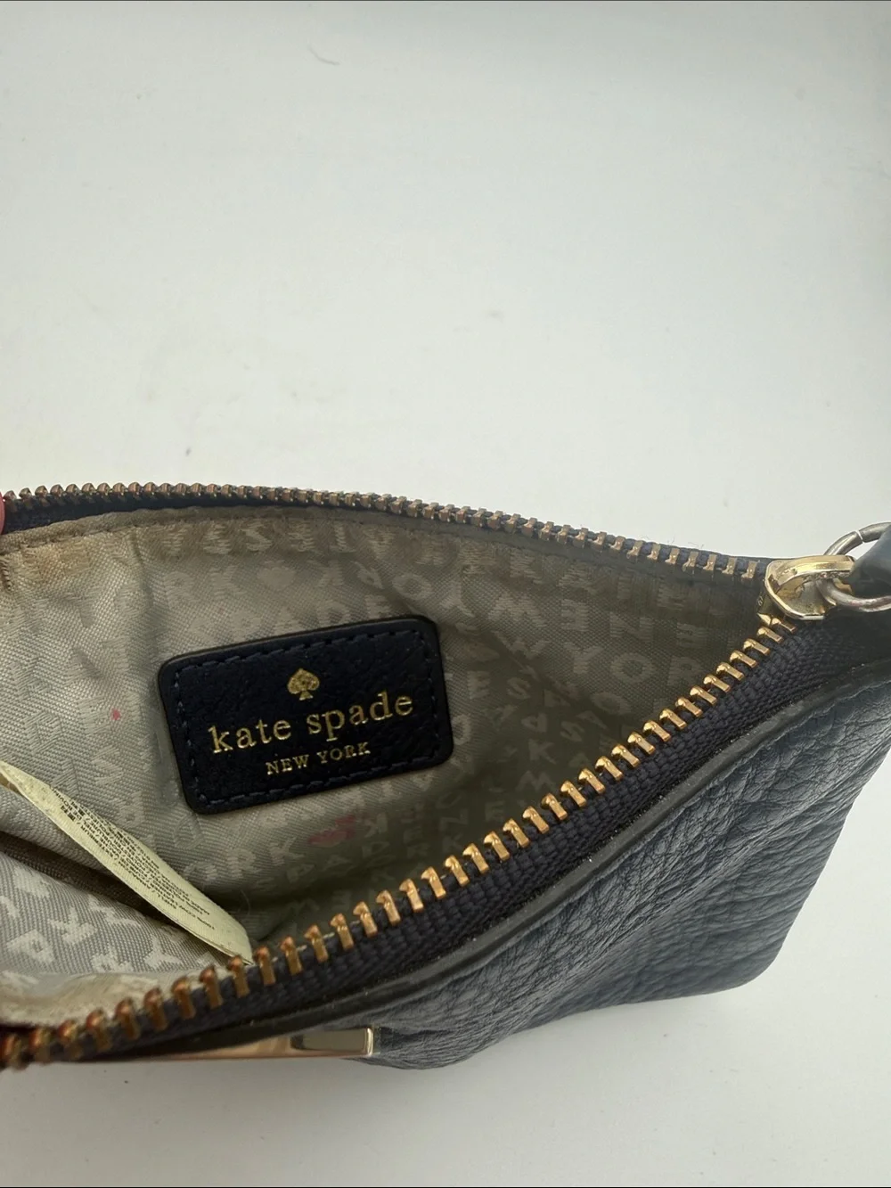 kate spade navy pebbled leather wristlet wi/  gold logo 6.5x4”